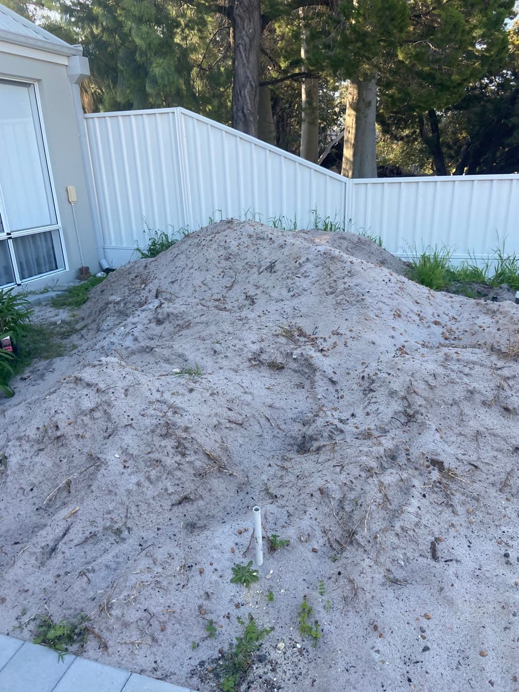 Site cleared with clean fill sand ready for the new install.